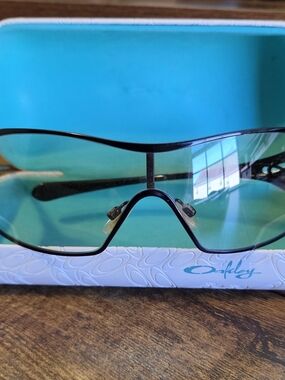 Oakley Black Frame Sunglasses with Teal Lenses